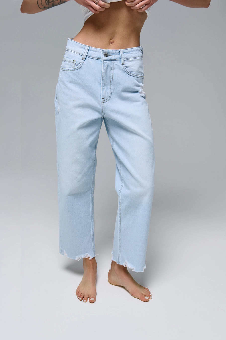 STRAIGHT jeans in light blue color with distressed details Clean Lines